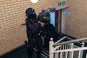 Firearms officers check for danger.