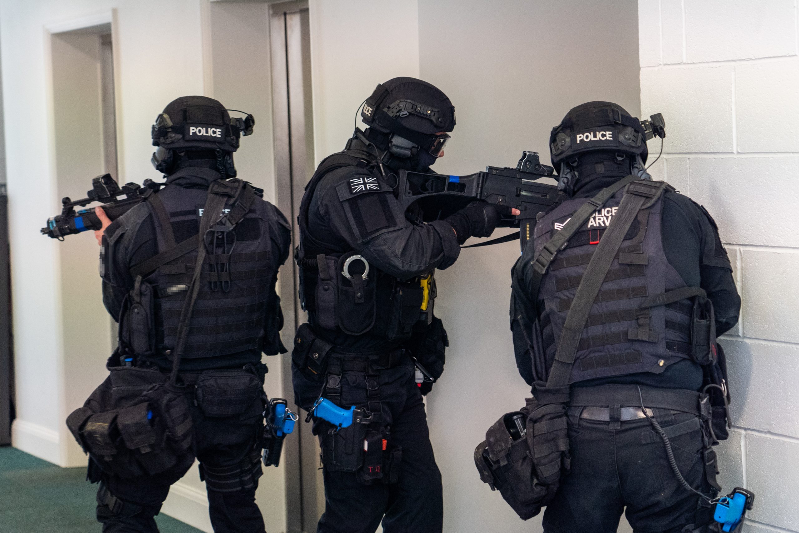 Two firearms officers make the scene safe.